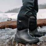 Waterproof boots in icy river